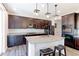 Beautiful kitchen with an island, granite countertops, and stainless steel appliances at 9835 Uravan St, Commerce City, CO 80022