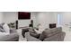 Spacious living room with comfortable seating, perfect for entertaining guests or Gathering time at 9835 Uravan St, Commerce City, CO 80022