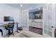 Home office with french doors, modern desk, and good natural light at 9835 Uravan St, Commerce City, CO 80022