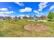 Gathering-friendly neighborhood park with playground, seating, and landscaped green space at 9835 Uravan St, Commerce City, CO 80022