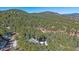 An aerial view of a home nestled among trees at 22683 Hagler Dr, Golden, CO 80401