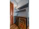 Stylish bar area featuring a wine fridge, floating shelves, and a wooden door for an elegant touch at 22683 Hagler Dr, Golden, CO 80401