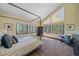 Bedroom with tall windows, four-poster bed frame and window views at 22683 Hagler Dr, Golden, CO 80401