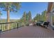 Large wooden deck with comfortable seating and breathtaking mountain views at 22683 Hagler Dr, Golden, CO 80401
