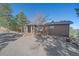 A home with gravel driveway and rock walls at 22683 Hagler Dr, Golden, CO 80401