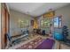 Bright home gym featuring multiple windows, various exercise equipment, and hardwood floors at 22683 Hagler Dr, Golden, CO 80401