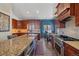 Bright kitchen featuring stainless steel appliances, granite countertops and custom cabinetry at 22683 Hagler Dr, Golden, CO 80401
