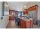 Gourmet kitchen with stainless steel appliances, granite countertops, and center island at 22683 Hagler Dr, Golden, CO 80401