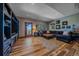 Spacious living room featuring wood floors, large sofa, multiple windows with views, and recessed lighting at 22683 Hagler Dr, Golden, CO 80401