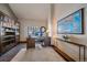 Home office features built-in bookcase, desk, and a large world map wall art at 22683 Hagler Dr, Golden, CO 80401