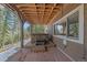 Patio area with hot tub and partial covering; mountain views in background at 22683 Hagler Dr, Golden, CO 80401