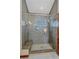 Modern shower with glass enclosure, bench and mosaic tile accents at 22683 Hagler Dr, Golden, CO 80401
