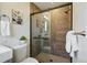 Updated bathroom featuring a glass shower, modern fixtures, and stylish tile surround at 12345 W 32Nd Ave, Wheat Ridge, CO 80033