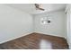 This bedroom has wood floors and windows that fill the room with plenty of natural light at 12345 W 32Nd Ave, Wheat Ridge, CO 80033