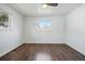 This bedroom has wood floors and windows that fill the room with plenty of natural light at 12345 W 32Nd Ave, Wheat Ridge, CO 80033