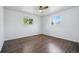 This bedroom has wood floors and windows that fill the room with plenty of natural light at 12345 W 32Nd Ave, Wheat Ridge, CO 80033