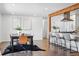 Open concept dining area and kitchen with modern finishes, stylish furnishings, and ample counter space at 12345 W 32Nd Ave, Wheat Ridge, CO 80033