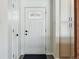 Inviting foyer with a decorative front door, closet, and built-in cabinets at 12345 W 32Nd Ave, Wheat Ridge, CO 80033