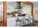 Updated kitchen featuring granite countertops, stainless steel appliances and a breakfast bar at 12345 W 32Nd Ave, Wheat Ridge, CO 80033
