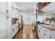 Open concept kitchen offers stainless steel appliances, granite counters, and ample cabinet space at 12345 W 32Nd Ave, Wheat Ridge, CO 80033