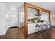 Bright, updated kitchen with granite counters, stainless appliances, and breakfast bar with seating at 12345 W 32Nd Ave, Wheat Ridge, CO 80033