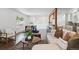 Open living space with modern furnishings, a dining area, and a seamless transition to the kitchen at 12345 W 32Nd Ave, Wheat Ridge, CO 80033