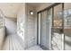 A neutral-toned balcony with room for seating, accessible through sliding glass doors at 23558 Pondview Pl # B, Golden, CO 80401