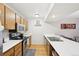 Bright kitchen with light wood cabinets, stainless steel appliances, and a spacious white countertop at 23558 Pondview Pl # B, Golden, CO 80401
