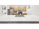 Well-lit kitchen featuring stainless steel appliances, a double sink, and ample countertop space at 23558 Pondview Pl # B, Golden, CO 80401