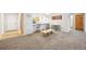 Open living area with a breakfast bar, and comfortable seating arrangement perfect for relaxing at 23558 Pondview Pl # B, Golden, CO 80401