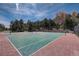 Outdoor tennis court surrounded by trees, perfect for active recreation at 23558 Pondview Pl # B, Golden, CO 80401
