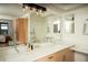 Bright and airy bathroom featuring double sinks with designer fixtures and vanity area at 1401 Wewatta St # 808, Denver, CO 80202