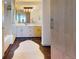 Modern bathroom with dual vanity, sleek finishes, and separate tub and glass-enclosed shower at 1401 Wewatta St # 808, Denver, CO 80202