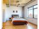 Cozy bedroom with a large window, modern furnishings, and wood floors, providing a comfortable and inviting space at 1401 Wewatta St # 808, Denver, CO 80202