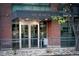 Waterside Lofts main entrance at 1401 Wewatta, with brick facade and metal accents in a desirable urban location at 1401 Wewatta St # 808, Denver, CO 80202