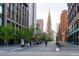 Downtown street view showcasing the vibrant city life, tree-lined streets, and historical buildings at 1401 Wewatta St # 808, Denver, CO 80202