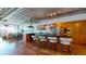 Bright, modern kitchen with stainless steel appliances, a breakfast bar, and open access to the living room at 1401 Wewatta St # 808, Denver, CO 80202