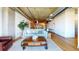 Stylish living room with open floor plan, hardwood floors, and exposed ductwork at 1401 Wewatta St # 808, Denver, CO 80202