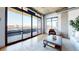 Sun-filled living room with hardwood floors, industrial ceilings and city views at 1401 Wewatta St # 808, Denver, CO 80202