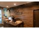 Welcoming lobby featuring Waterside Lofts sign with wood paneling and front desk at 1401 Wewatta St # 808, Denver, CO 80202