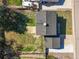 Aerial view of the house showing the roof, driveway, and surrounding landscaping at 9940 Pecos St, Thornton, CO 80260