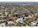 Expansive aerial view of a residential neighborhood featuring mature trees at 9940 Pecos St, Thornton, CO 80260