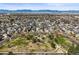 Neighborhood aerial view showcasing a park, mature trees, and the surrounding residential area at 9940 Pecos St, Thornton, CO 80260