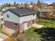 A view of the backyard featuring a well-maintained lawn and a concrete patio area perfect for outdoor entertaining at 9940 Pecos St, Thornton, CO 80260