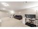 Open basement featuring a seating area and functional work space at 9940 Pecos St, Thornton, CO 80260
