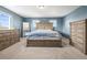 Spacious bedroom with two windows, carpet floors and wood furniture at 9940 Pecos St, Thornton, CO 80260