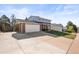 A two-story home featuring a spacious driveway, and a convenient two-car garage at 9940 Pecos St, Thornton, CO 80260
