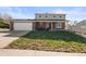Inviting two-story home with a well-maintained lawn, brick accents, and a convenient two-car garage at 9940 Pecos St, Thornton, CO 80260