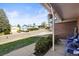Cozy front porch with seating, hanging plants, and a view of the quiet neighborhood street at 9940 Pecos St, Thornton, CO 80260