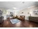 Inviting living room with a fireplace, wood floors, and comfortable seating arrangements at 9940 Pecos St, Thornton, CO 80260